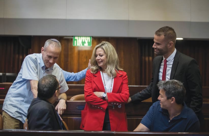 UNITED BLUE and White: Chili Tropper (top left) and Yoaz Hendel (bottom right) talk with fellow incoming MKs (from left: Zvi Hauser, Miki Haimovich, Yorai Lahav Hertzanu) ahead of 21st Knesset opening session, April 2019 (photo credit: NOAM REVKIN FENTON/FLASH90)