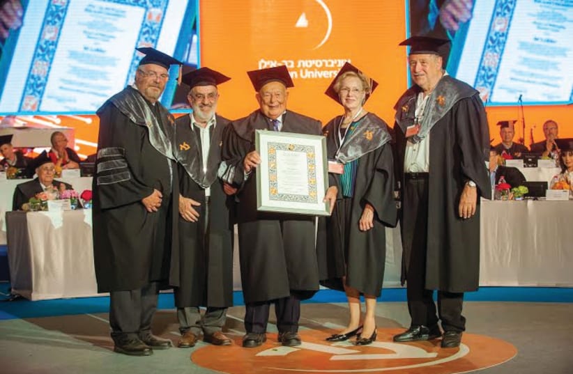 ISI LEIBLER receives his honorary doctorate at Bar-Ilan University with his wife, Naomi, and BIU faculty members. (photo credit: COURTESY BIU)