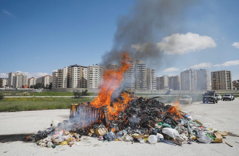 THE JERUSALEM MUNICIPALITY burns a pile of hametz collected from across the city, last year. (photo credit: RONEN ZVULUN/REUTERS)