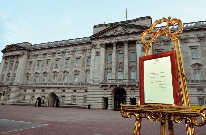 A NOTICE formally announces the birth of a son to Britain’s Prince William and Catherine, Duchess of Cambridge, in the forecourt of Buckingham Palace, in July 2013. (photo credit: NEIL HALL/REUTERS)