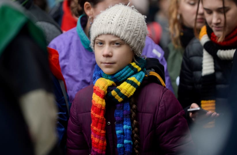 Swedish climate activist Greta Thunberg takes part in the rally ''Europe Climate Strike'' in Brussels, Belgium, March 6, 2020.  (photo credit: REUTERS/JOHANNA GERON/FILE PHOTO)