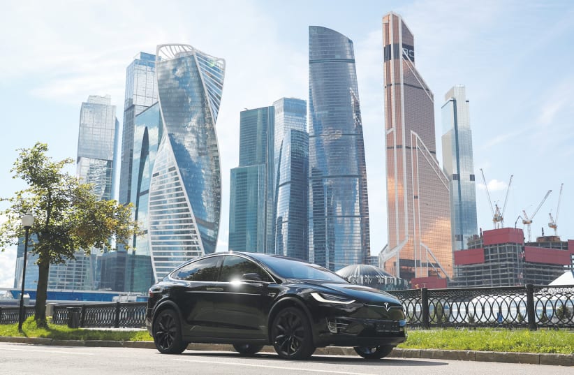 A TESLA Model X electric vehicle is shown in this picture illustration taken in Moscow last year. (photo credit: EVGENIA NOVOZHENINA/REUTERS)