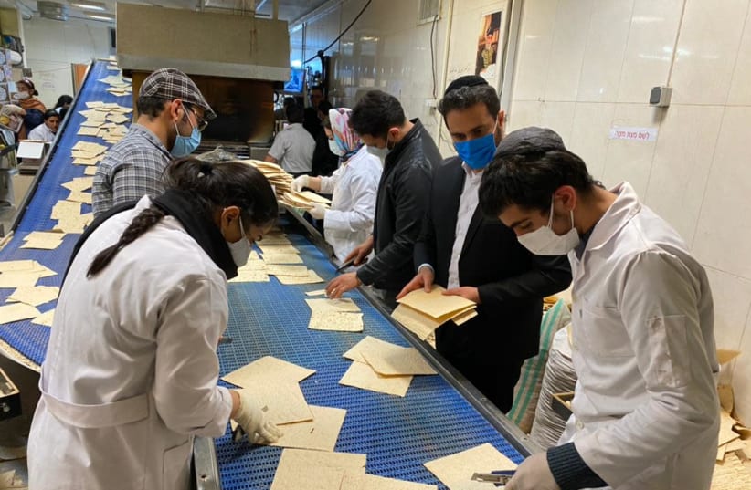  Jews in Tehran producing matza this week ahead of the Passover holiday. (photo credit: THE ALLIANCE OF RABBIS IN ISLAMIC STATES)