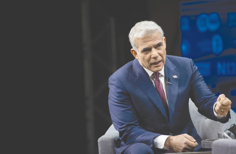 YESH ATID Party leader Yair Lapid – voting for him is voting for sanity. (photo credit: YONATAN SINDEL/FLASH90)