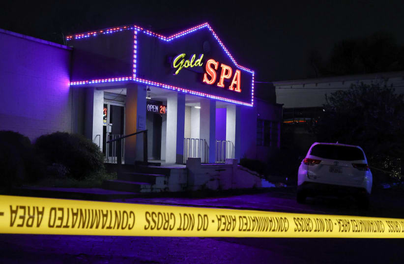 Crime scene tape surrounds Gold Spa after deadly shootings at a massage parlor and two day spas in the Atlanta area, in Atlanta, Georgia, U.S. March 16, 2021. (photo credit: CHRIS ALUKA BERRY/ REUTERS)