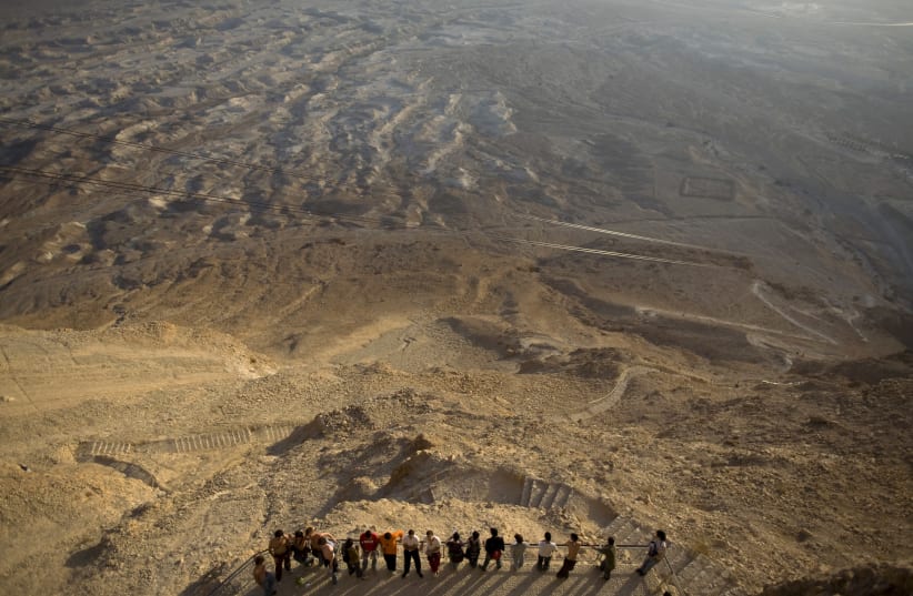 Tourists at Masada in 2008. The novel takes place during the Great Jewish Revolt against Rome, a war that ended at the battle of Masada. (photo credit: REUTERS)