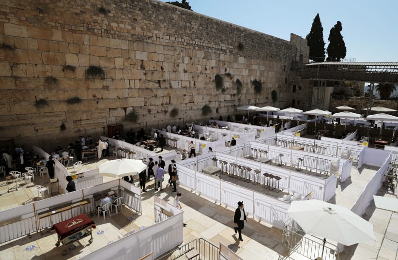 The Western Wall last year. A radical Jewish poet in the 1930s equated Jewish clannishness to American racism, using the Western Wall as an indictment of Zionism. (photo credit: AMMAR AWAD/REUTERS)
