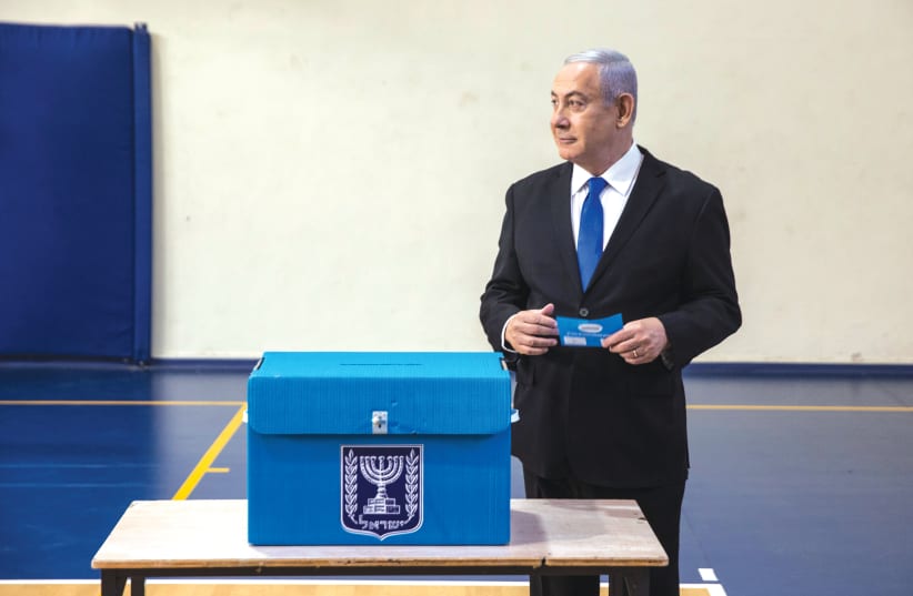 Prime Minister Benjamin Netanyahu votes  in the September 2019 election. (photo credit: HEIDI LEVINE)