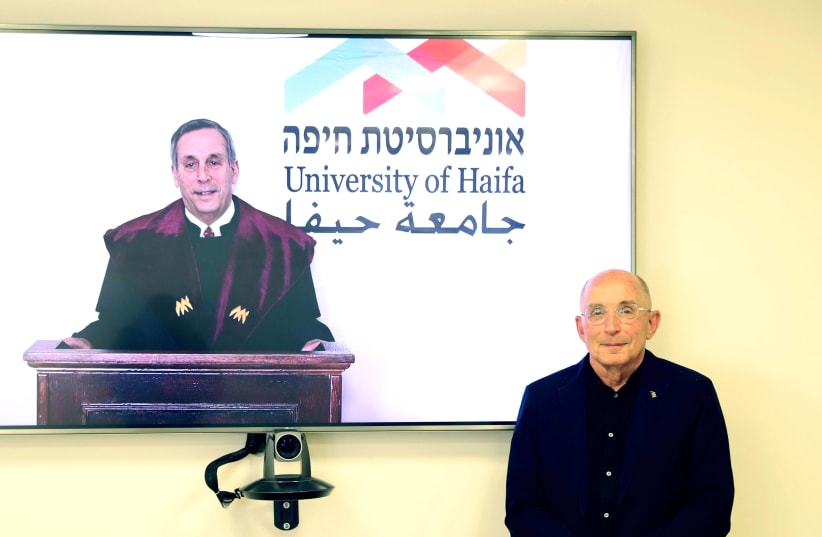 President Bacow receiving an honorary doctorate from University of Haifa (photo credit: UNIVERSITY OF HAIFA)