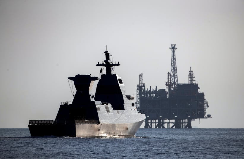 The Saar-6 corvette, a warship dubbed "Shield", cruises near the production platform of Leviathan natural gas field after a welcoming ceremony by the Israeli navy marking its arrival, in the Mediterranean Sea off the coast of Haifa on December 1, 2020.  (photo credit: RONEN ZVULUN / REUTERS)