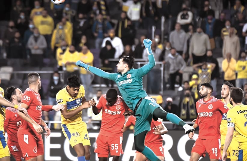  IN A fiesty Tel Aviv derby on Saturday night at Bloomfield, Maccabi Tel Aviv was held to a 1-1 draw by Hapoel Tel Aviv, which almost pulled off the upset. (photo credit: ARIEL SHALOM)