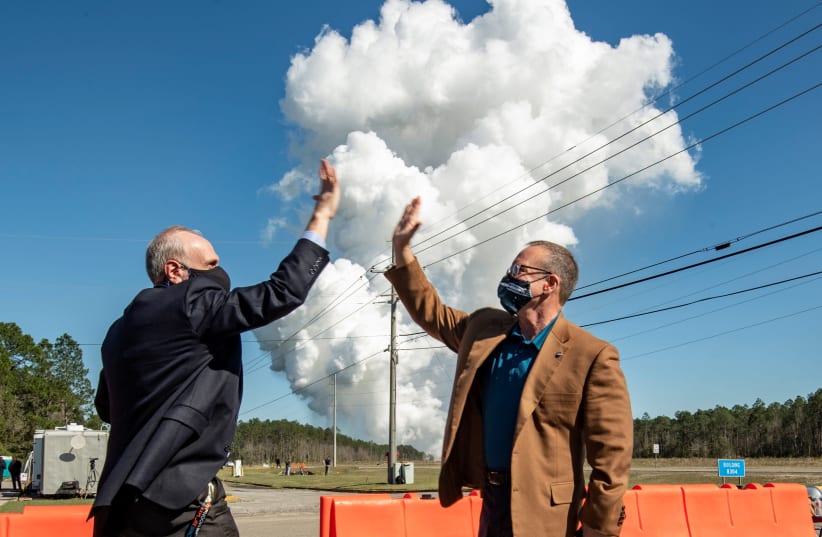 Acting NASA Administrator Steve Jurczyk (L) and Rick Gilbrech, director of NASA's Stennis Space Center react following a second hot fire test of the core stage of a Boeing-built rocket for Artemis missions (photo credit: NASA/ROBERT MARKOWITZ/HANDOUT VIA REUTERS)