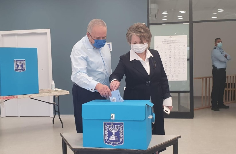 Head of Yisrael Beytenu Party, Avigdor Liberman, together with his wife, Ella Liberman, voted in a polling station near their house in Nokdim. (photo credit: MIRI SHIMONOVITZ)