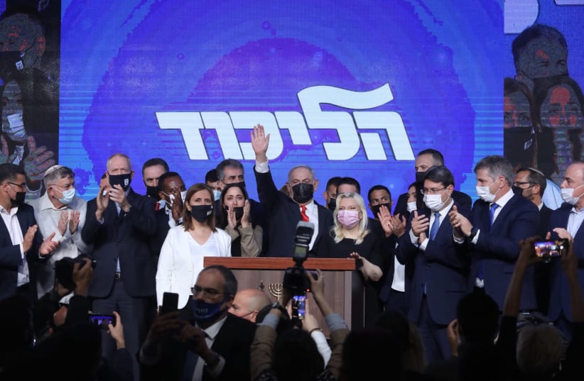 Prime Minister Benjamin Netanyahu celebrates with the Likud after Israel's elections, March 23, 2021. (photo credit: MARC ISRAEL SELLEM/THE JERUSALEM POST)