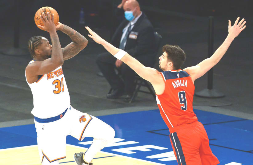 WASHINGTON WIZARDS Israeli rookie Deni Avdija (right) defends New York Knicks forward Julius Randle, who scored a game-high 37 points for the host Knicks in a 131-113 victory over the Wizards on Tuesday night at Madison Square Garden. (photo credit: VINCENT CARCHIETTA/USA TODAY SPORTS)
