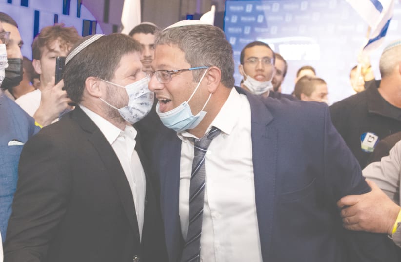 BEZALEL SMOTRICH (left) and Itamar Ben-Gvir celebrate at Religious Zionist Party headquarters in Modi’in on election night (photo credit: SRAYA DIAMANT/FLASH90)