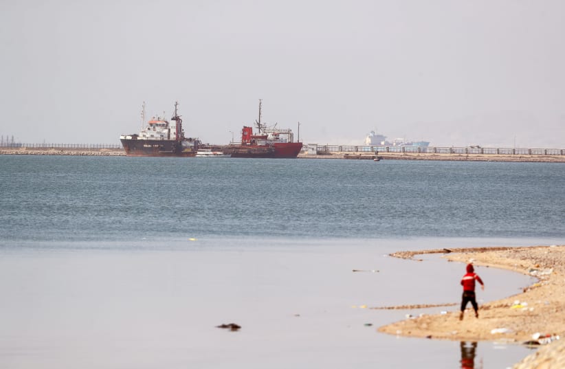 Ships are seen at the entrance of the Suez Canal, Egypt March 26, 2021. (photo credit: MOHAMED ABD EL GHANY/REUTERS)