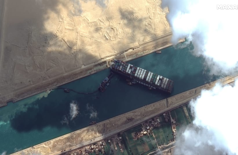 Ever Given container ship is pictured in Suez Canal in this Maxar Technologies satellite image taken on March 26, 2021. Maxar Technologies/Handout via REUTERS (photo credit: REUTERS)