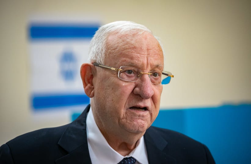 President Reuven Rivlin casts his ballot at a voting station in Jerusalem, during the Knesset Elections, on March 23, 2021.  (photo credit: OLIVIER FITOUSSI/FLASH90)