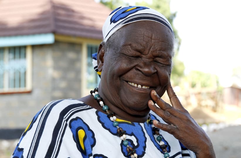 Sarah Hussein Obama, step-grandmother to US President Barack Obama, smiles at their homestead in the village of Kogelo, west of Kenya's capital Nairobi, July 14, 2015. US President Barack Obama visits Kenya and Ethiopia later this month. His ancestral home of Kogelo is home to Sarah Hussein Obama, h (photo credit: REUTERS/THOMAS MUKOYA)