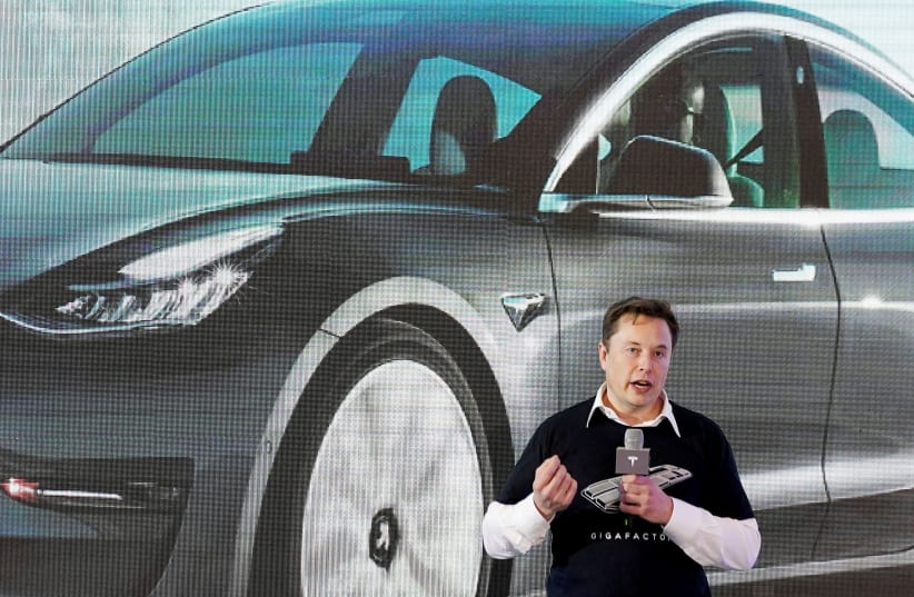 Tesla Inc CEO Elon Musk speaks onstage during a delivery event for Tesla China-made Model 3 cars at its factory in Shanghai, China January 7, 2020. (photo credit: REUTERS/ALY SONG/FILE PHOTO)