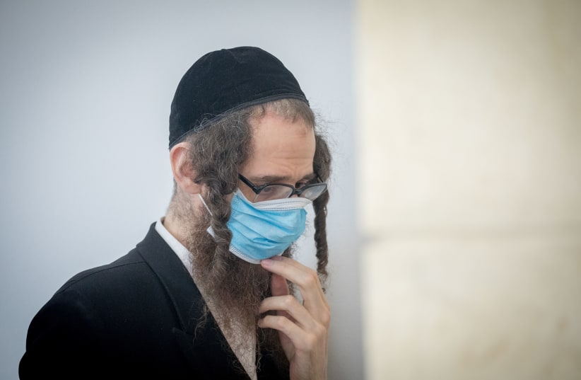 Eliezer Rumpler, from the Lev Tahor Haredi Jewish sect   arrives to the Jerusalem District Court for a court hearing on June 28, 2020.  (photo credit: YONATAN SINDEL/FLASH 90)