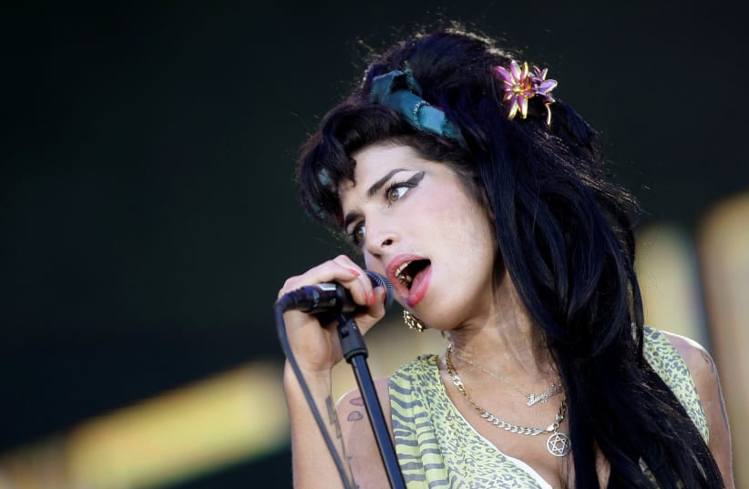 British singer Amy Winehouse performs during the "Rock in Rio" music festival in Arganda del Rey, near Madrid, July 4, 2008 (photo credit: REUTERS/JUAN MEDINA/FILE PHOTO)