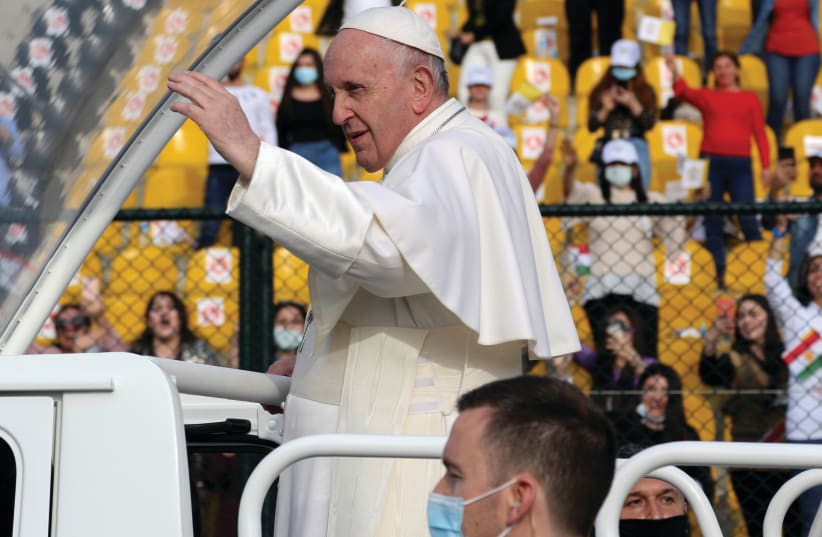 POPE FRANCIS gestures as he arrives to lead a Mass at the Franso Hariri Stadium in Erbil, Iraq, last month. (photo credit: AZAD LASHKARI / REUTERS)