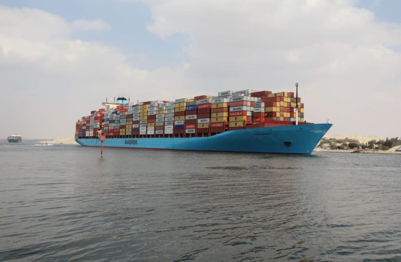 A container ship sails at the Suez Canal, in Ismailia, Egypt March 31, 2021. Suez Canal Authority/Handout via REUTERS (photo credit: REUTERS)