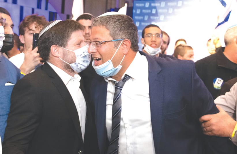 TKUMA PARTY head Bezalel Smotrich and Itamar Ben-Gvir of the Otzma Yehudit Party celebrate at Religious Zionist Party headquarters in Modi’in last Tuesday night. (photo credit: SRAYA DIAMANT/FLASH90)