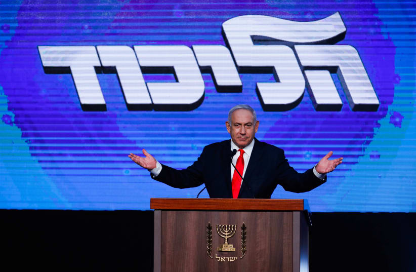 Prime Minister Benjamin Netanyahu addresses his supporters on the night of the Israeli elections, at the party headquarters in Jerusalem, March 24, 2021.  (photo credit: OLIVIER FITOUSSI/FLASH90)