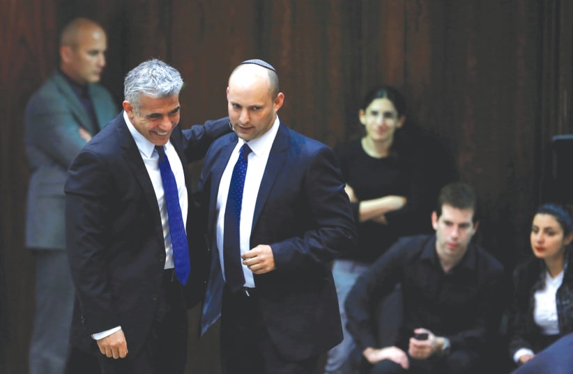 CAN THEY work together to form a coalition? Naftali Bennett and Yair Lapid in the Knesset in 2013. (photo credit: BAZ RATNER/REUTERS)