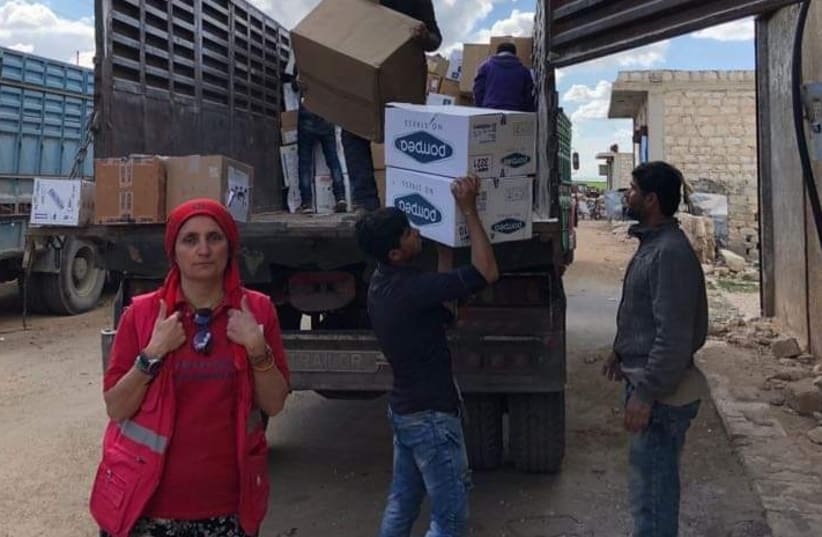 Dr. Nemam Ghafouri delivering humanitarian aid. (photo credit: Courtesy)