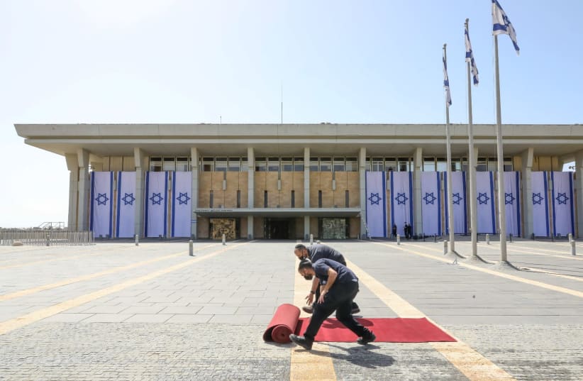 The red carpet is rolled out in front of the Knesset before the new MKs are sworn in. (photo credit: MARC ISRAEL SELLEM/THE JERUSALEM POST)