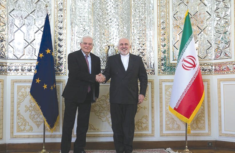IRANIAN FOREIGN MINISTER Mohammed Javad Zarif (right) shakes hands with Josep Borrell, high representative of the EU for foreign affairs and security policy and vice president of European Commission, in Tehran in February. (photo credit: TASNIM NEWS AGENCY/REUTERS)