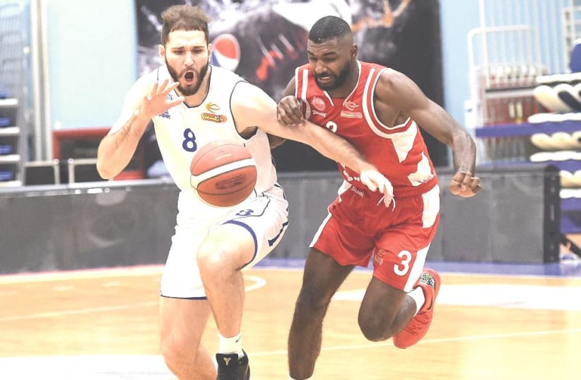 HAPOEL BEERSHEBA and Bnei Herzliya engaged in a fierce Winner League battle on Monday night, with Amir Bell (right) and Beersheba prevailing 77-75.  (photo credit: BERNEY ARDOV)