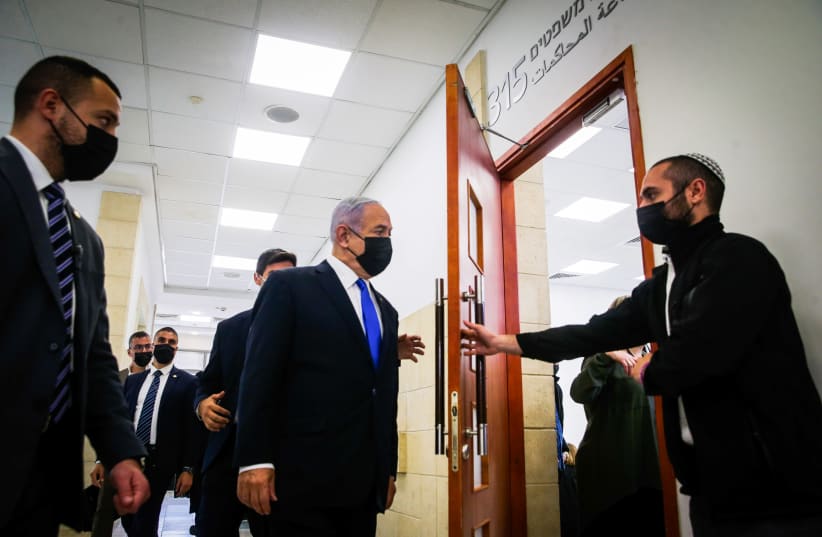 Israeli prime minister Benjamin Netanyahu seen as he arrives for a court hearing at the District Court in Jerusalem on April 05, 2021, PM Netanyahu is on trial on criminal allegations of bribery, fraud and breach of trust. (photo credit: OREN BEN HAKOON/POOL)