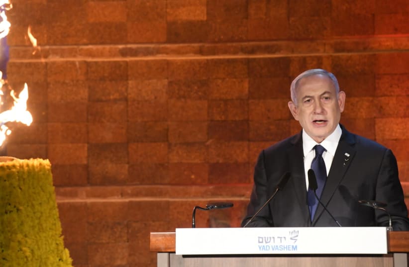 Prime Minister Benjamin Netanyahu speaks at Yad Vashem for Holocaust Remembrance Day, April 7, 2021. (photo credit: AMOS BEN-GERSHOM/GPO)