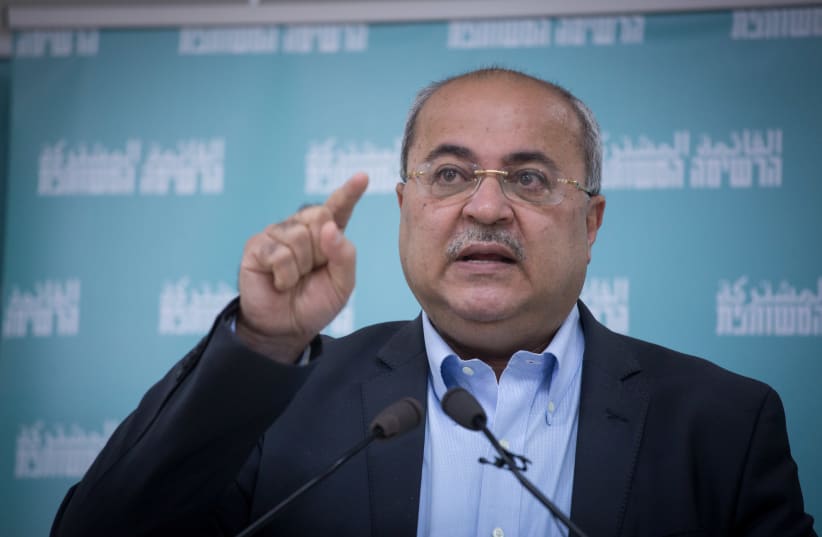 Joint list party member Ahmad Tibi speaks during a press conference presenting the Joint list hebrew election campaign in Tel Aviv, February 23, 2021.  (photo credit: MIRIAM ALSTER/FLASH90)