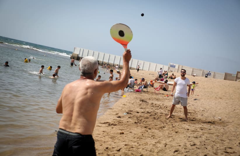 PLAYING MATKOT on Acre beach, which is equipped with a path for disabled swimmers (#42) (photo credit: DAVID COHEN/FLASH 90)