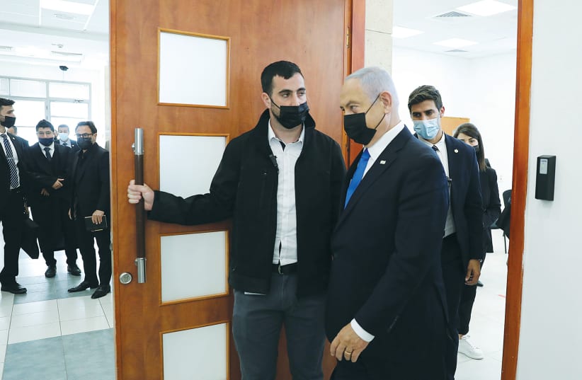 PRIME MINISTER Benjamin Netanyahu leaves the courtroom after a hearing at the Jerusalem District Court this week. (photo credit: ABIR SULTAN/POOL)