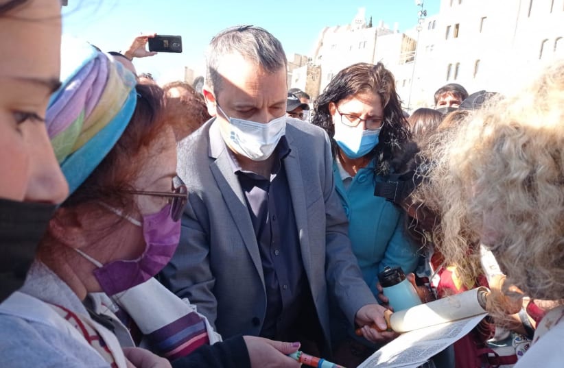 MK Kariv reads Torah scroll at Western Wall plaza  (photo credit: WOMEN OF THE WALL)