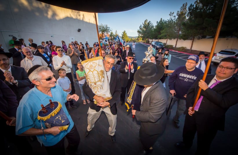 Members of the Ahavas Torah Center in Henderson parade through the city during a Torah dedication ceremony in the mid-2010s. The Las Vegas suburb is home to a growing Orthodox Jewish population. (photo credit: COURTESY OF AHAVAS TORAH CENTER)