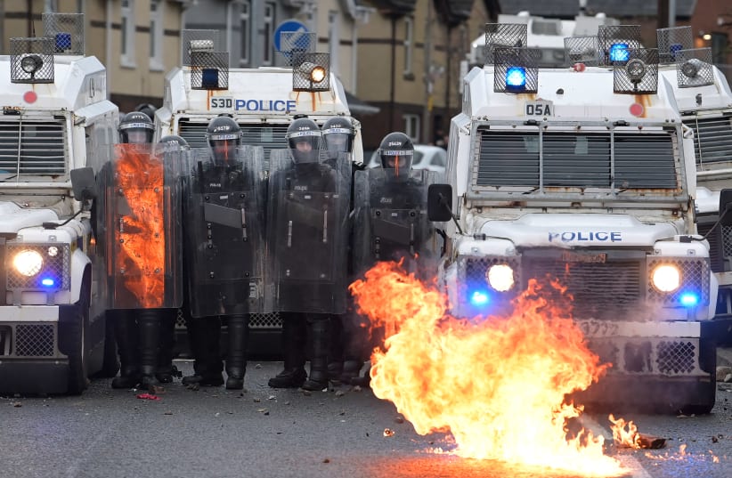 Nationalists attack police in Belfast, April 8, 2021 (photo credit: CHARLES MCQUILLAN/GETTY IMAGES)