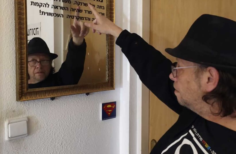 Ofer Aloni during his guided tour of the “Holocaust or Hope Mini Museum and Escape Room” in Jerusalem (photo credit: Courtesy)