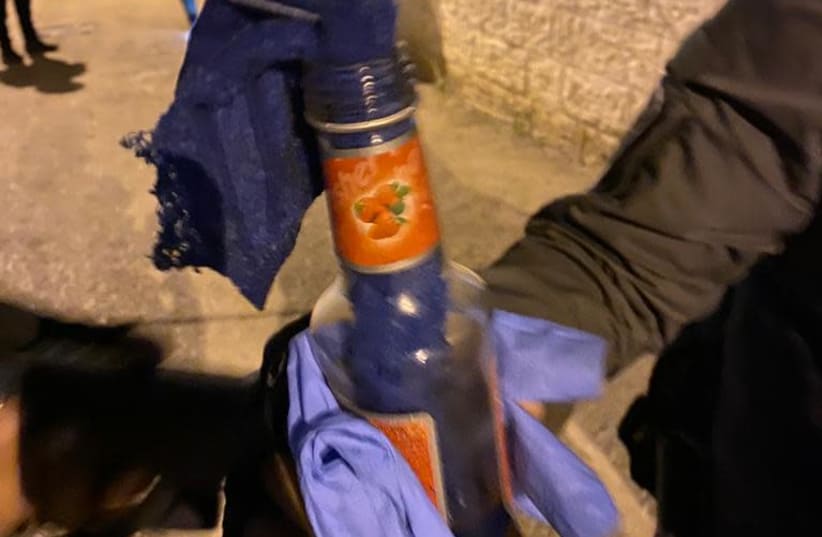 A Molotov cocktail from the brawl between two rival families in Ramle, in which 69 locals were arrested by Israel Police, April 16, 2021.  (photo credit: ISRAEL POLICE)