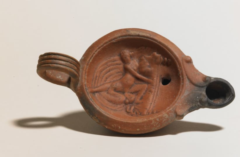 A 1st century AD Terracotta Roman lamp from Turkey, depicting two women engaged in oral sex, generally regarded as taboo by the Romans. (photo credit: HANDOUT/BRITISH MUSEUM VIA THOMSON REUTERS FOUNDATION)