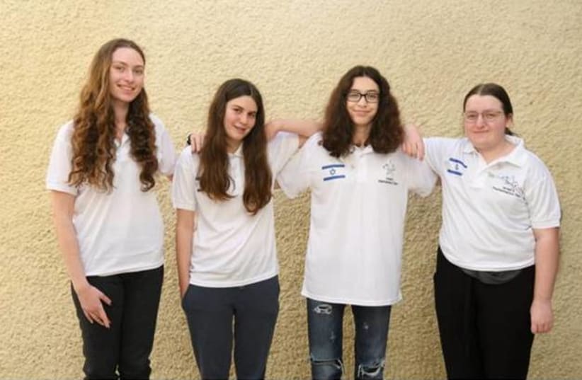 The Israeli delegation for the 2021 European Girls Mathematical Olympiad (EGMO) stands together after the competition. Left to right: Nicole Grossman, Noga Friedman, Tamar Pe'er and Ya'ara Shulman (photo credit: FUTURE SCIENTISTS CENTER)