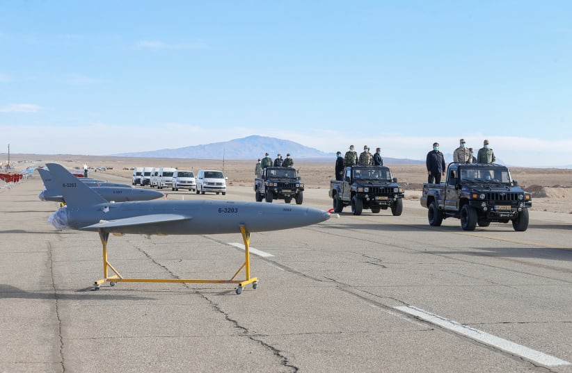 Iranian Armed Forces Chief of Staff Major General Mohammad Bagheri and other top commanders inspect drones as they are prepared for large-scale drone combat exercise of Army of the Islamic Republic of Iran, in Semnan, Iran January 4, 2021 (photo credit: IRANIAN ARMY/WANA/REUTERS)