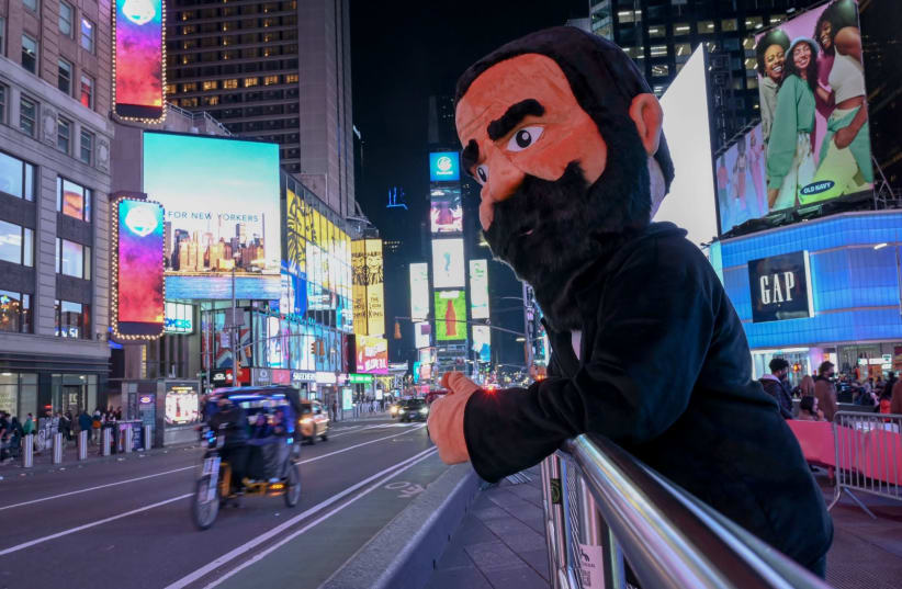 A man dressed as Theodor Herzl reinacts his famous pose in New York City's Times Square (photo credit: ISRAEL-AMERICAN COUNCIL)